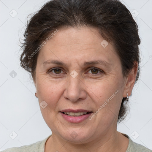 Joyful white adult female with short  brown hair and brown eyes