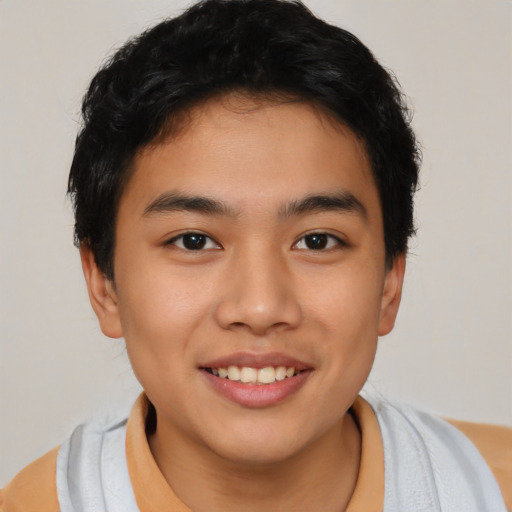 Joyful asian young-adult male with short  brown hair and brown eyes