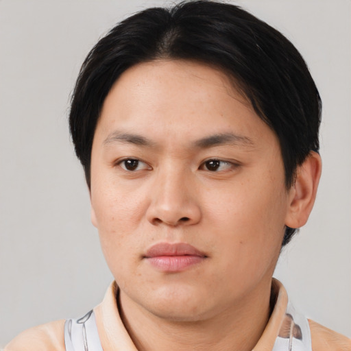 Neutral asian adult male with short  brown hair and brown eyes