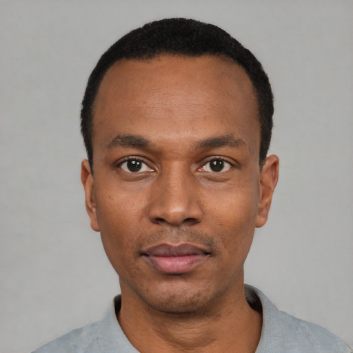 Neutral black adult male with short  black hair and brown eyes