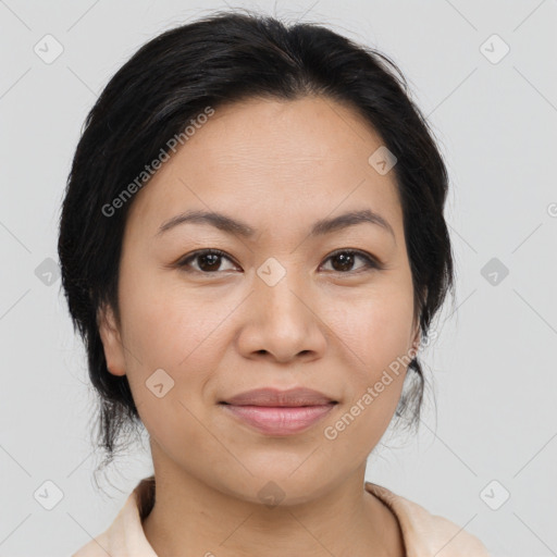 Joyful latino young-adult female with medium  brown hair and brown eyes