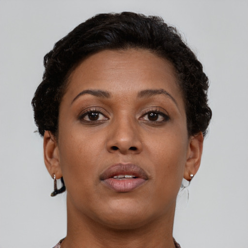 Neutral black young-adult female with short  brown hair and brown eyes