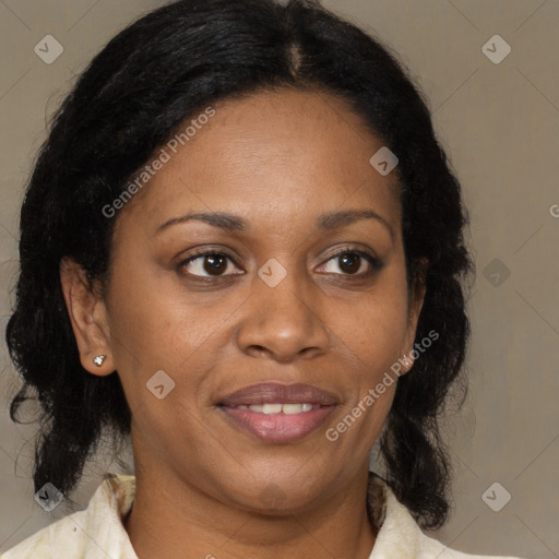 Joyful black adult female with medium  brown hair and brown eyes