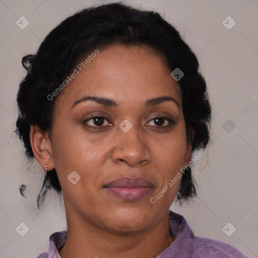 Joyful black adult female with short  black hair and brown eyes