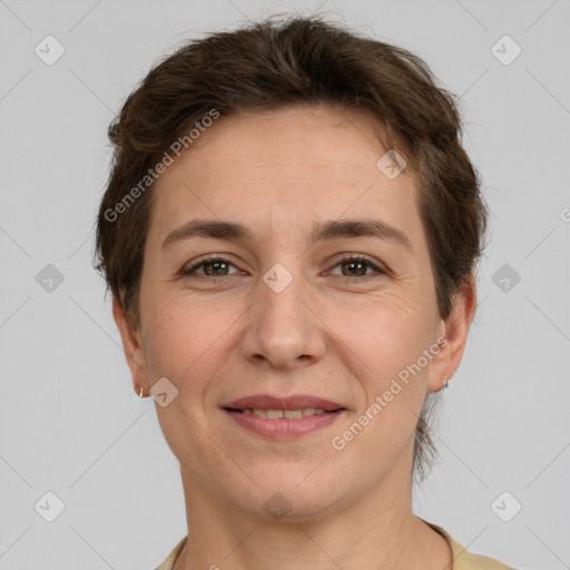 Joyful white adult female with short  brown hair and grey eyes