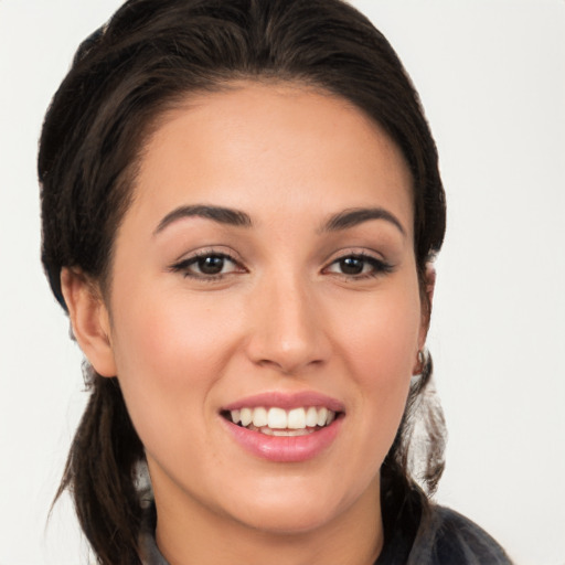 Joyful white young-adult female with long  brown hair and brown eyes