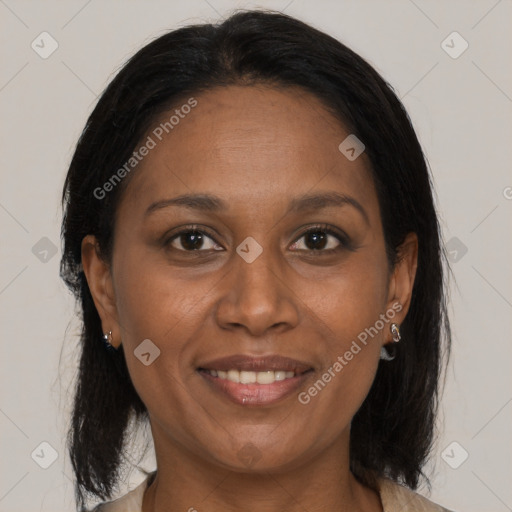 Joyful black adult female with medium  brown hair and brown eyes