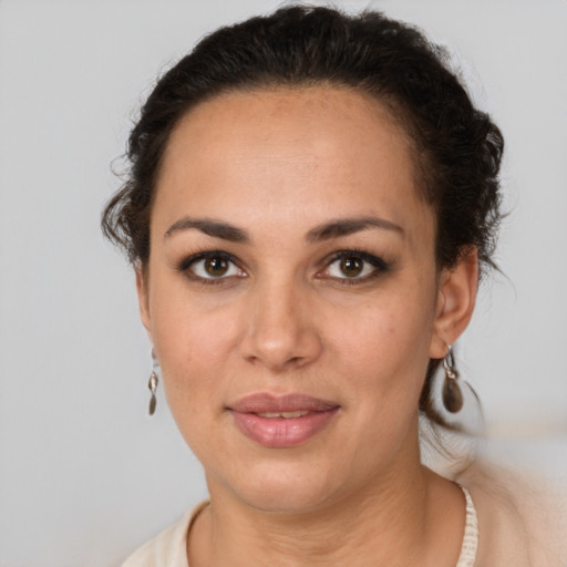 Joyful latino young-adult female with short  brown hair and brown eyes