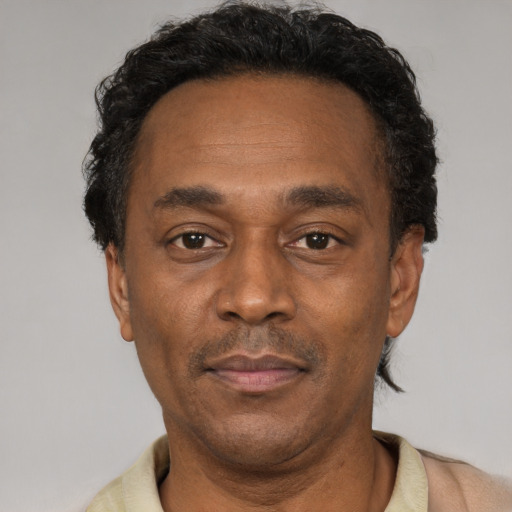 Neutral latino adult male with short  black hair and brown eyes