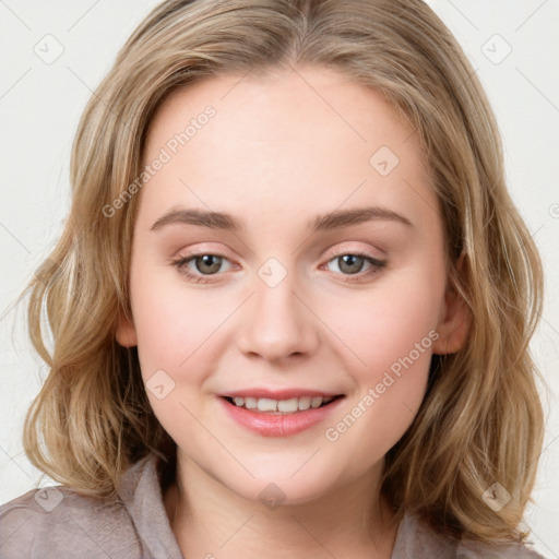 Joyful white young-adult female with medium  brown hair and green eyes