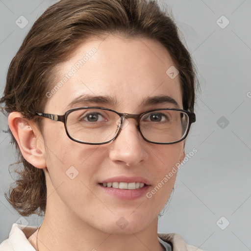 Joyful white adult female with medium  brown hair and blue eyes