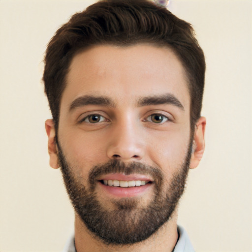 Joyful white young-adult male with short  black hair and brown eyes