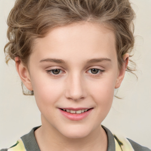 Joyful white child female with short  brown hair and brown eyes