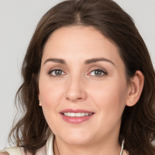 Joyful white young-adult female with medium  brown hair and brown eyes