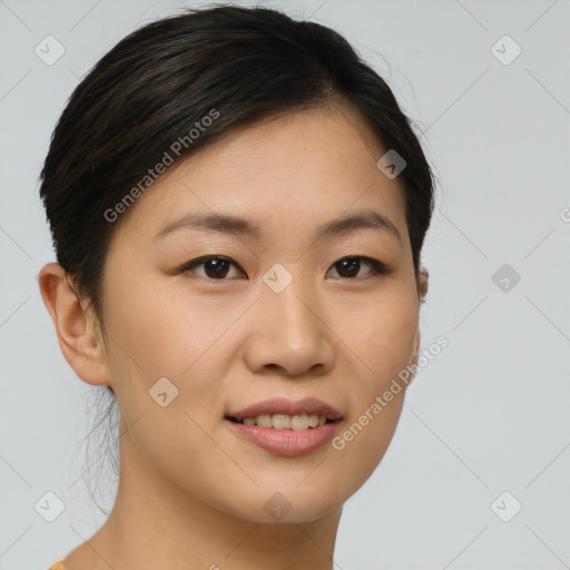 Joyful asian young-adult female with short  brown hair and brown eyes