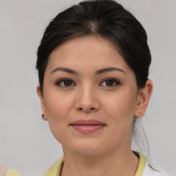 Joyful asian young-adult female with medium  brown hair and brown eyes