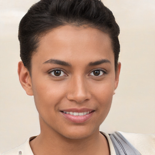 Joyful white young-adult female with short  brown hair and brown eyes