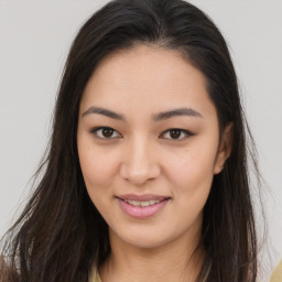 Joyful asian young-adult female with long  brown hair and brown eyes