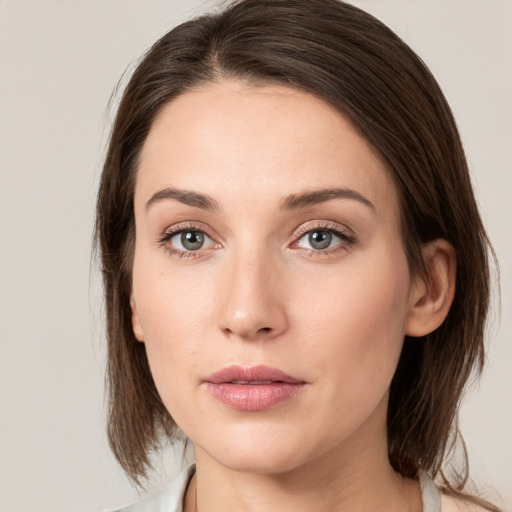 Neutral white young-adult female with medium  brown hair and grey eyes