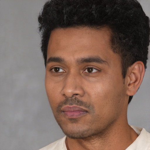Neutral latino young-adult male with short  black hair and brown eyes