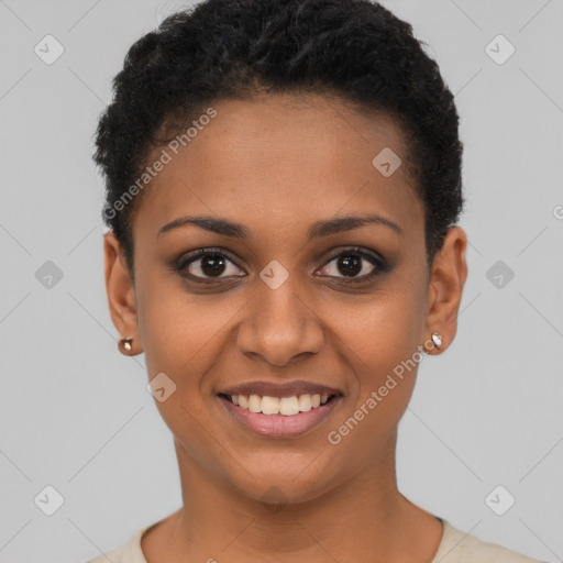 Joyful black young-adult female with short  black hair and brown eyes