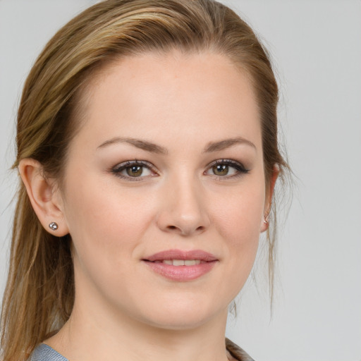 Joyful white young-adult female with medium  brown hair and blue eyes