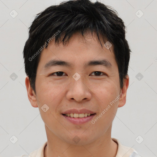 Joyful asian young-adult male with short  brown hair and brown eyes