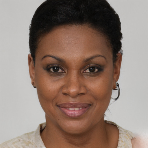 Joyful black young-adult female with short  brown hair and brown eyes