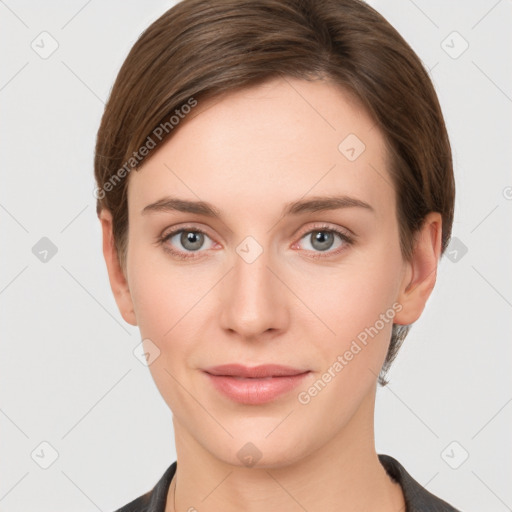 Joyful white young-adult female with short  brown hair and grey eyes