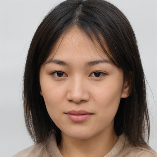 Neutral asian young-adult female with medium  brown hair and brown eyes