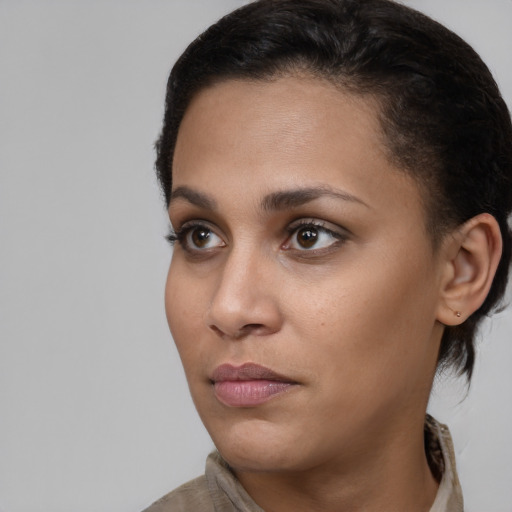 Neutral latino young-adult female with short  brown hair and brown eyes