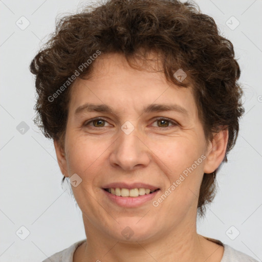 Joyful white adult female with short  brown hair and brown eyes