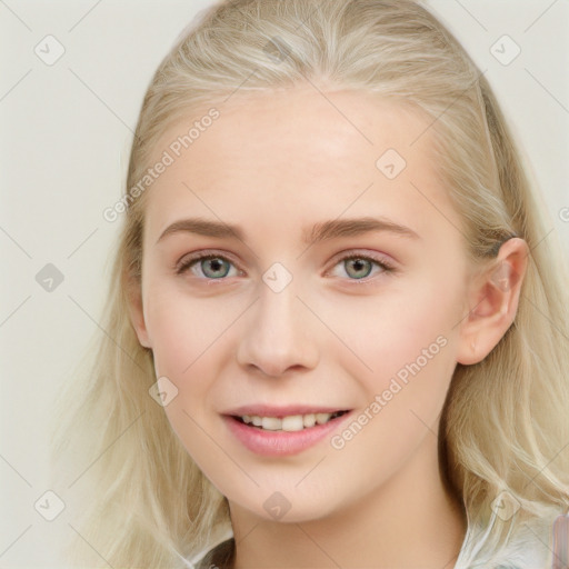 Joyful white young-adult female with long  brown hair and blue eyes