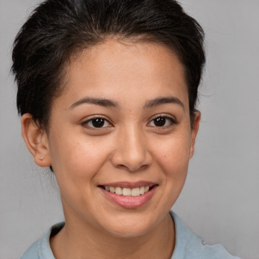 Joyful white young-adult female with short  brown hair and brown eyes