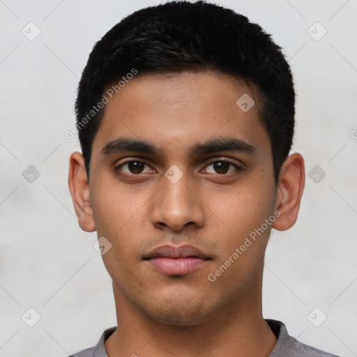 Neutral latino young-adult male with short  black hair and brown eyes