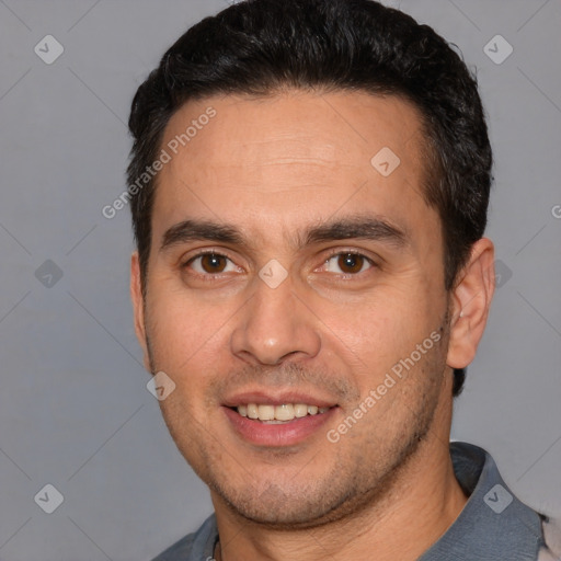 Joyful white young-adult male with short  black hair and brown eyes