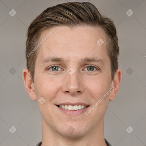 Joyful white adult male with short  brown hair and grey eyes