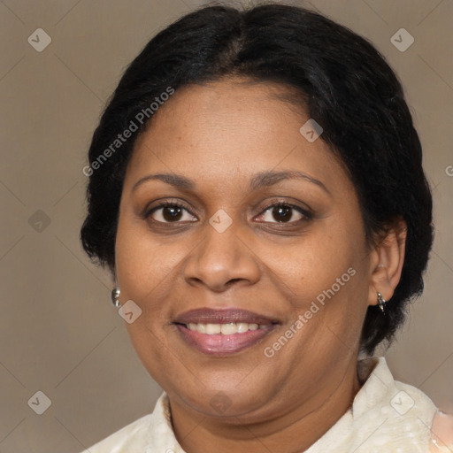 Joyful black adult female with medium  brown hair and brown eyes