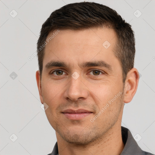 Joyful white young-adult male with short  brown hair and brown eyes