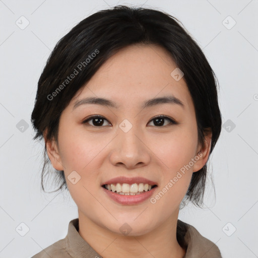 Joyful asian young-adult female with medium  black hair and brown eyes