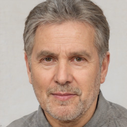 Neutral white middle-aged male with short  gray hair and brown eyes