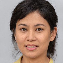 Joyful white young-adult female with medium  brown hair and brown eyes