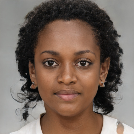 Neutral black young-adult female with medium  black hair and brown eyes