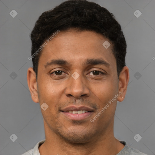 Joyful latino young-adult male with short  brown hair and brown eyes