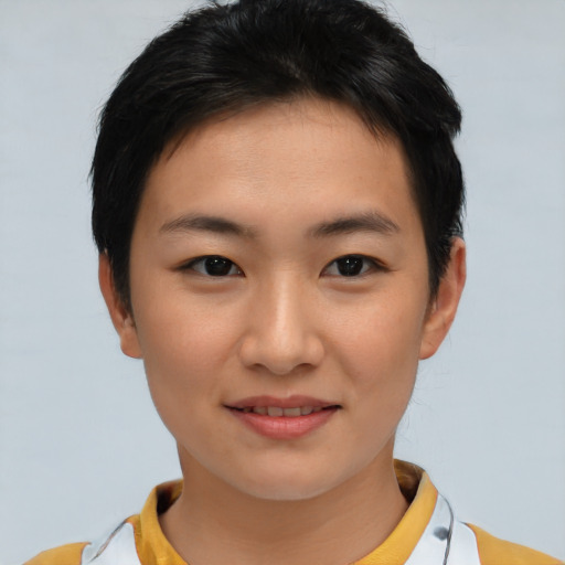 Joyful asian young-adult female with short  black hair and brown eyes