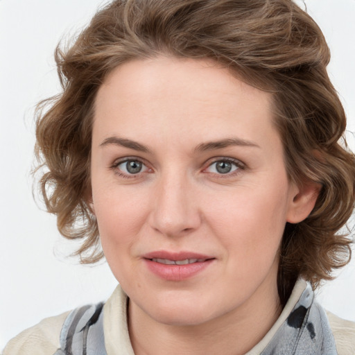 Joyful white young-adult female with medium  brown hair and blue eyes