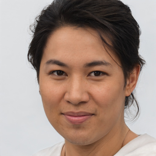 Joyful asian young-adult female with short  brown hair and brown eyes