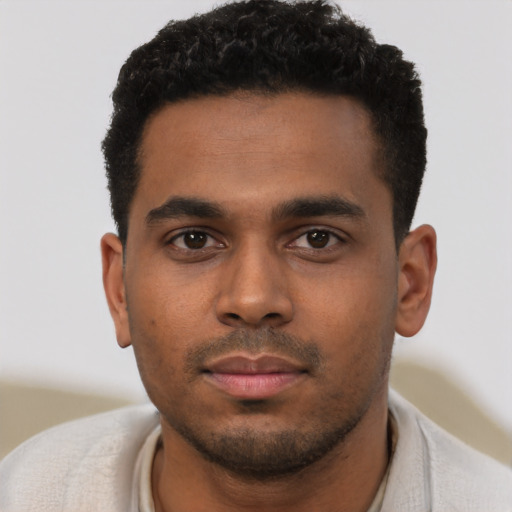 Neutral black young-adult male with short  black hair and brown eyes