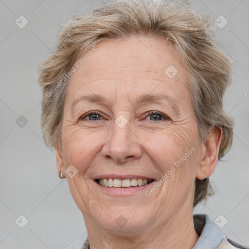 Joyful white middle-aged female with medium  brown hair and grey eyes