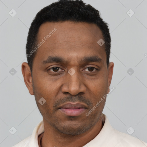 Neutral latino adult male with short  black hair and brown eyes